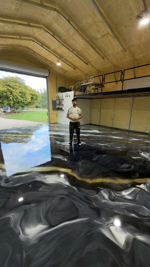 Black and gold metallic epoxy garage floor by EK Epoxy